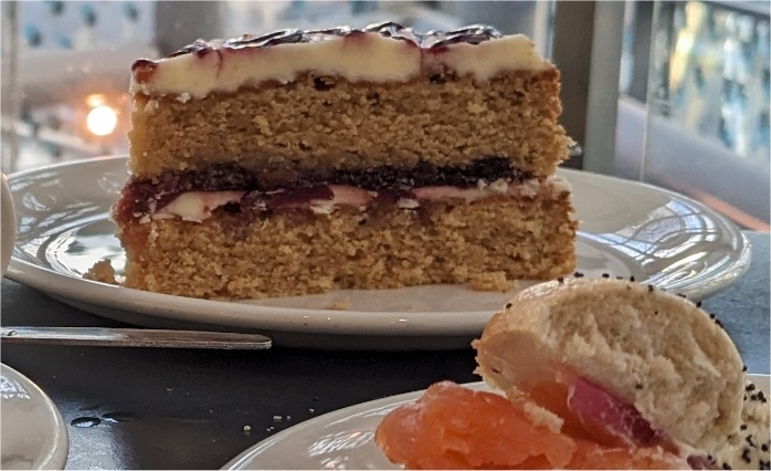 A large slice of a fancy cake on a plate.